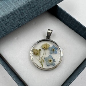 DIJE ACERO CON FLORES ENCAPSULADAS